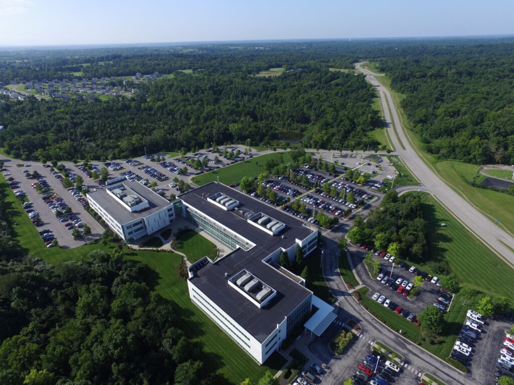 An ariel shot of a building with parking spaces